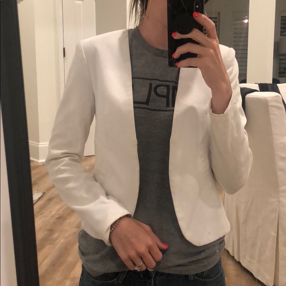 White blazer with flutter detail on back!